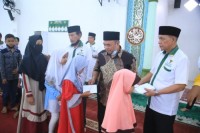 Pemkab Labuhanbatu Kembali Salurkan Zakat Melalui Baznas